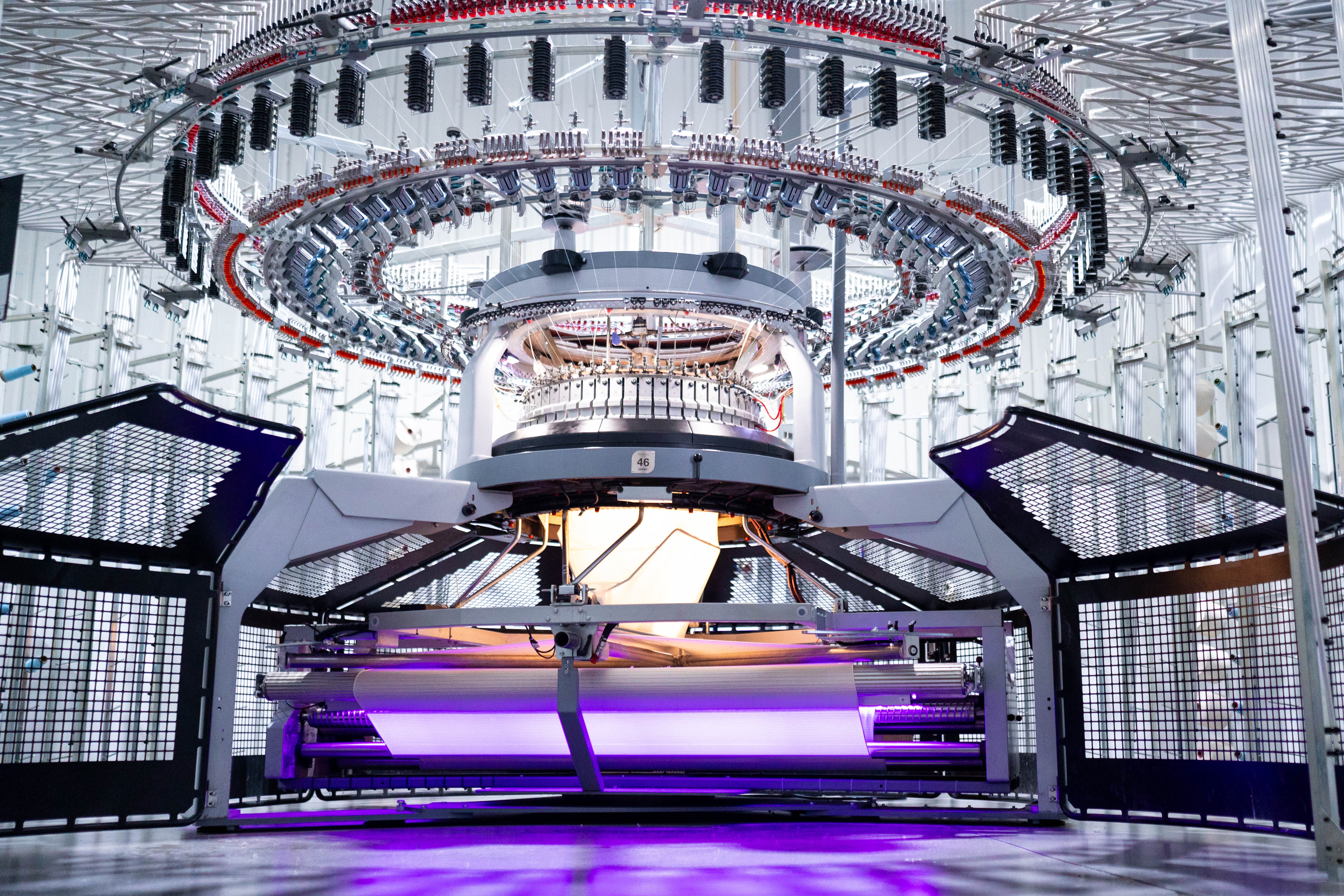 Open Circular Knitting Machine with purple light